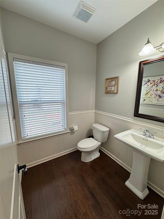 12517 Pine Terrace Ct, Charlotte, NC 28273 - bathroom featuring wood finished floors and a wainscoted wall