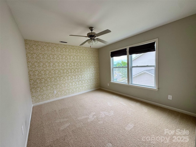 12517 Pine Terrace Ct, Charlotte, NC 28273 - unfurnished room with wallpapered walls, light colored carpet, and a ceiling fan