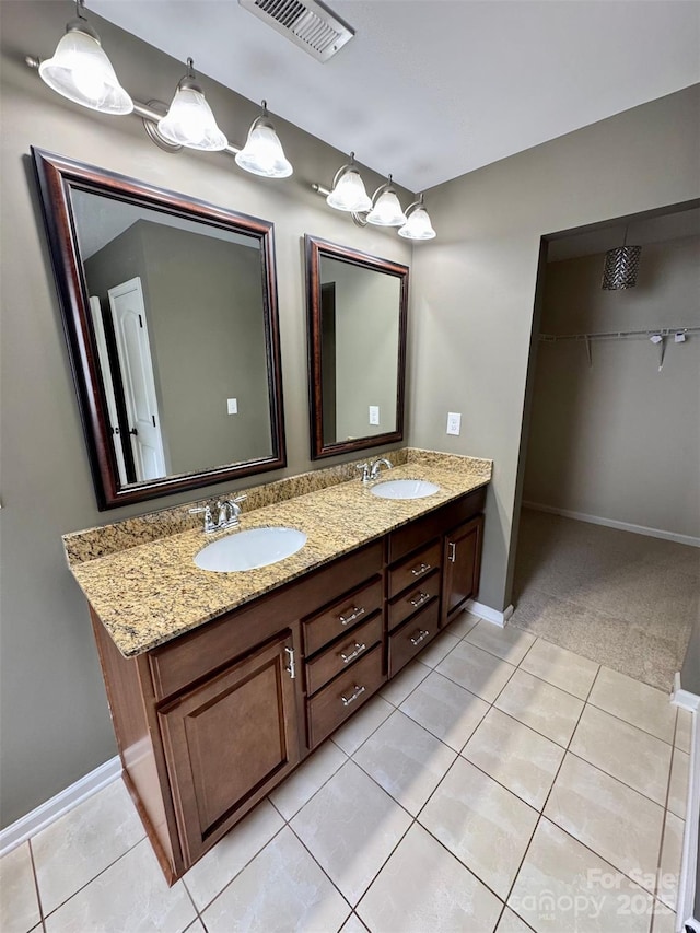 12517 Pine Terrace Ct, Charlotte, NC 28273 - bathroom featuring double vanity, tile patterned floors, and a walk in closet