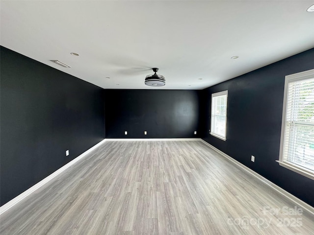 12517 Pine Terrace Ct, Charlotte, NC 28273 - spare room featuring light wood-type flooring, plenty of natural light, and recessed lighting