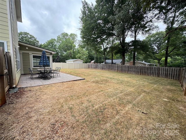 12517 Pine Terrace Ct, Charlotte, NC 28273 - fenced backyard featuring a patio and view of wooded area