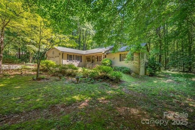 144 Beechwood Dr, Columbus, NC 28722 - view of front of property with an attached garage and a porch