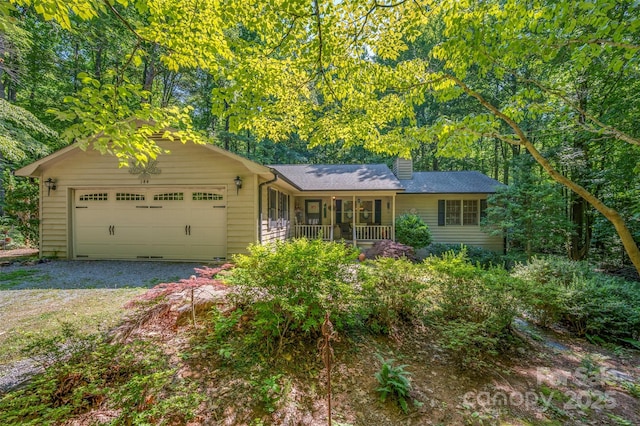 144 Beechwood Dr, Columbus, NC 28722 - single story home with a garage, a chimney, covered porch, roof with shingles, and driveway