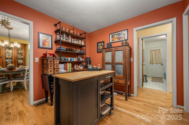 144 Beechwood Dr, Columbus, NC 28722 - office space featuring light wood finished floors and a chandelier