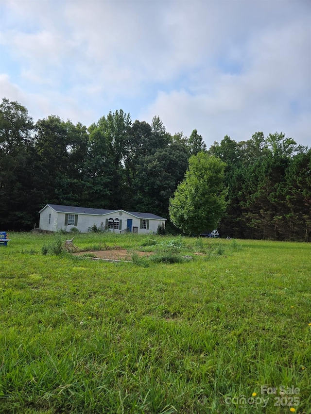 245 Waycross Dr, Rockwell, NC 28138 - view of green lawn featuring a forest view