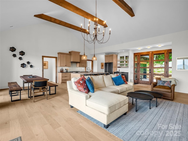 627 Cherry Hl Unit 201, Mill Spring, NC 28756 - living room featuring light wood-type flooring, high vaulted ceiling, beamed ceiling, and a chandelier