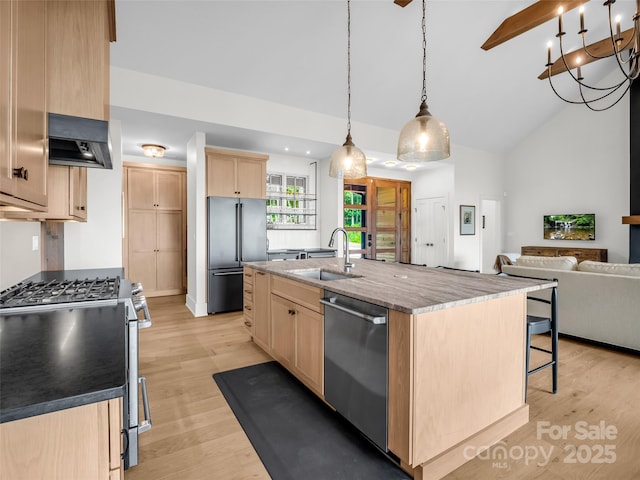 627 Cherry Hl Unit 201, Mill Spring, NC 28756 - kitchen featuring appliances with stainless steel finishes, light brown cabinetry, exhaust hood, light wood-type flooring, and a center island with sink