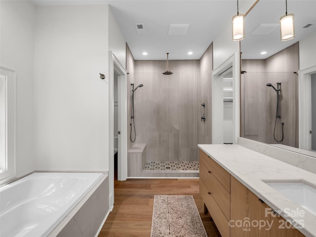 627 Cherry Hl Unit 201, Mill Spring, NC 28756 - full bath with a stall shower, a bath, vanity, wood finished floors, and recessed lighting