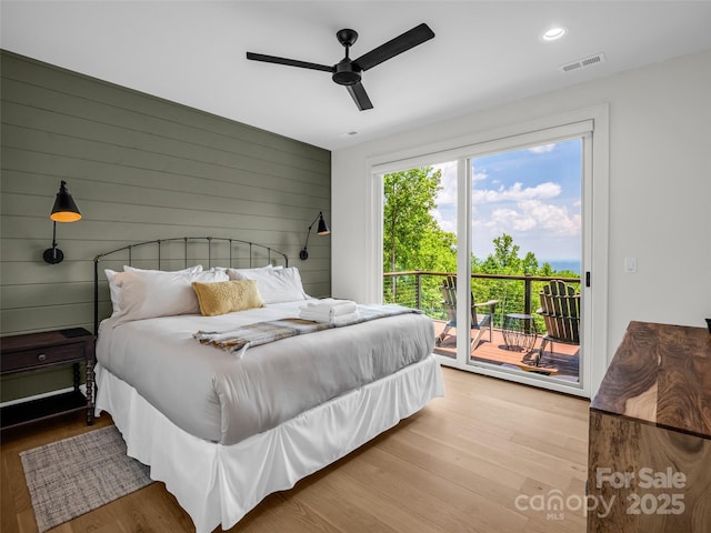 627 Cherry Hl Unit 201, Mill Spring, NC 28756 - bedroom featuring access to exterior, wood finished floors, ceiling fan, recessed lighting, and wood walls
