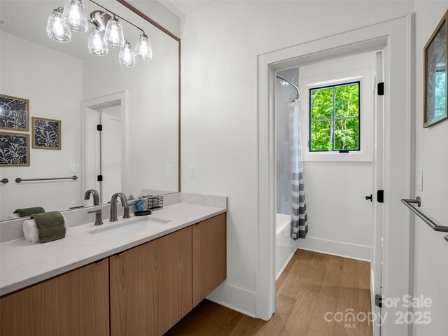 627 Cherry Hl Unit 201, Mill Spring, NC 28756 - bathroom featuring vanity, wood finished floors, and shower / bathtub combination with curtain