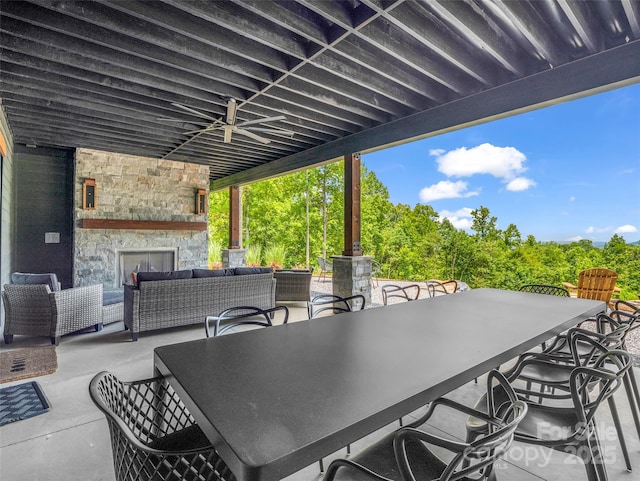 627 Cherry Hl Unit 201, Mill Spring, NC 28756 - view of patio featuring an outdoor living space with a fireplace and outdoor dining space