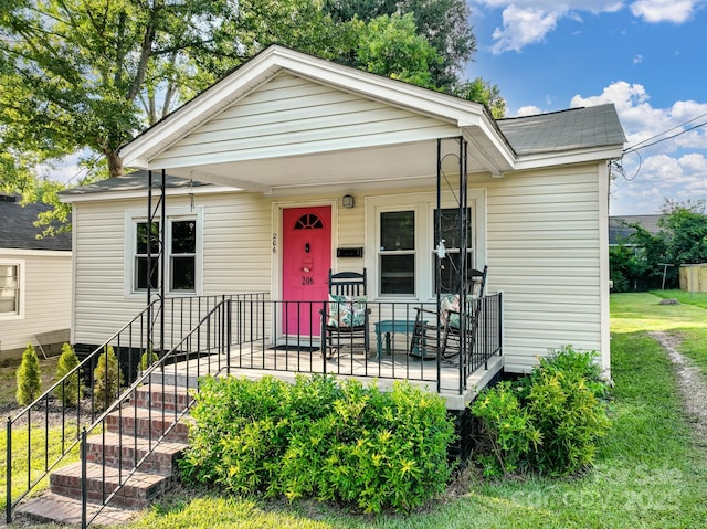 206 Friedheim Rd, Rock Hill, SC 29730 - view of front of home with covered porch, a front lawn, and roof with shingles