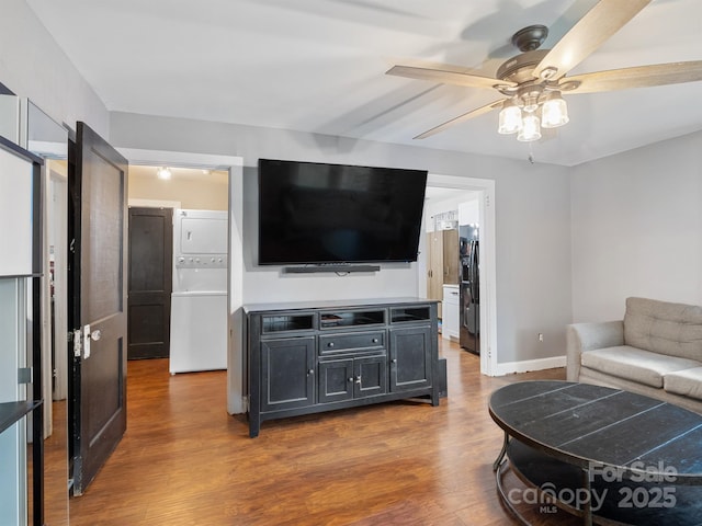 206 Friedheim Rd, Rock Hill, SC 29730 - living room with stacked washer and clothes dryer, ceiling fan, and wood finished floors