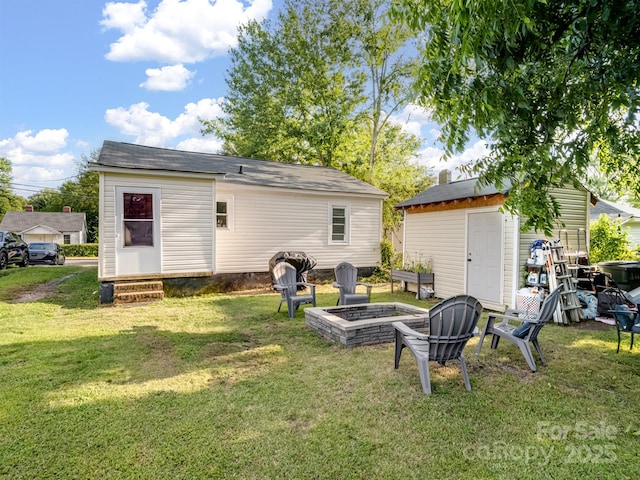 206 Friedheim Rd, Rock Hill, SC 29730 - rear view of property featuring an outdoor fire pit, a lawn, a storage unit, and entry steps