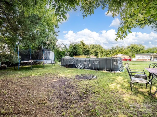 206 Friedheim Rd, Rock Hill, SC 29730 - view of green lawn with a trampoline and an outdoor pool