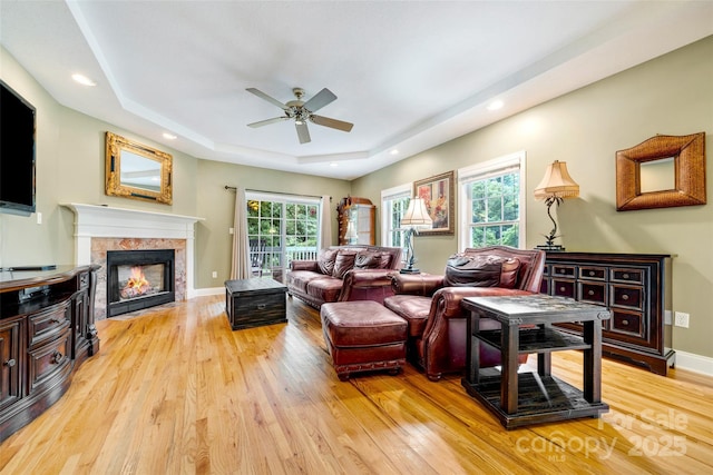 80 Meadow Creek Drive 40 & 61, Weaverville, NC 28787 - living area featuring a tray ceiling, ceiling fan, light wood finished floors, a tiled fireplace, and recessed lighting
