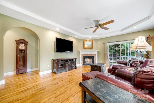 80 Meadow Creek Drive 40 & 61, Weaverville, NC 28787 - living area with a tray ceiling, a ceiling fan, light wood finished floors, a glass covered fireplace, and recessed lighting