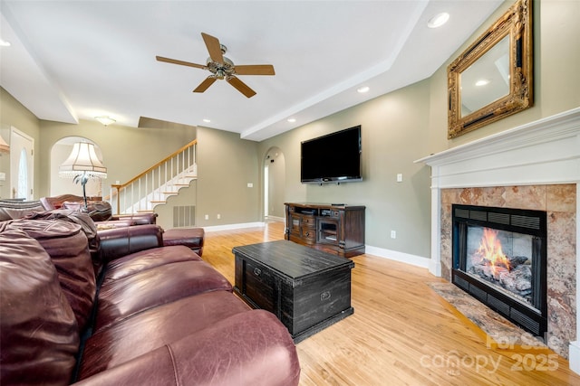 80 Meadow Creek Drive 40 & 61, Weaverville, NC 28787 - living room featuring arched walkways, a fireplace, a ceiling fan, light wood-style floors, and recessed lighting