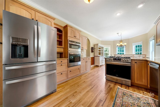 80 Meadow Creek Drive 40 & 61, Weaverville, NC 28787 - kitchen featuring appliances with stainless steel finishes, a chandelier, crown molding, light wood-type flooring, and a peninsula