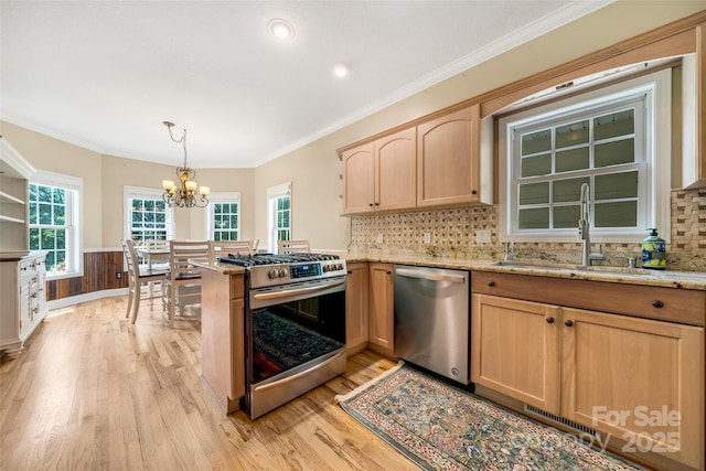 80 Meadow Creek Drive 40 & 61, Weaverville, NC 28787 - kitchen featuring appliances with stainless steel finishes, light brown cabinetry, light wood-type flooring, wainscoting, and a chandelier