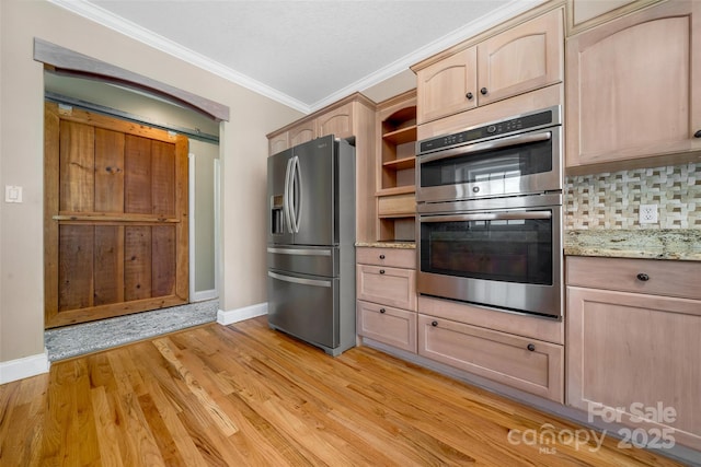 80 Meadow Creek Drive 40 & 61, Weaverville, NC 28787 - kitchen featuring stainless steel appliances, ornamental molding, light brown cabinetry, backsplash, and light wood-type flooring