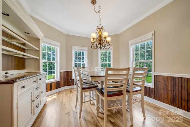 80 Meadow Creek Drive 40 & 61, Weaverville, NC 28787 - dining area featuring wainscoting, light wood-style flooring, a chandelier, wooden walls, and crown molding