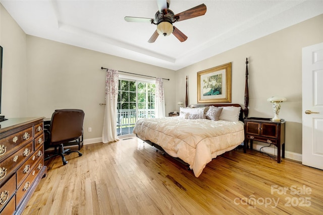 80 Meadow Creek Drive 40 & 61, Weaverville, NC 28787 - bedroom with access to exterior, light wood finished floors, a raised ceiling, and a ceiling fan