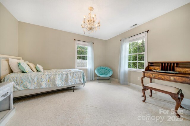 80 Meadow Creek Drive 40 & 61, Weaverville, NC 28787 - carpeted bedroom featuring a chandelier and baseboards