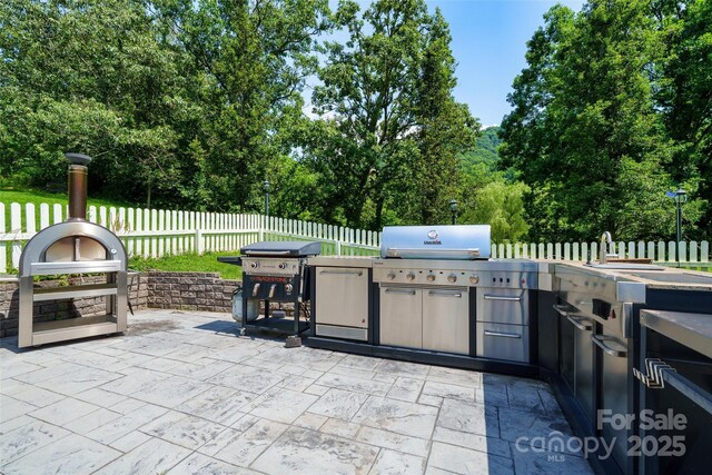80 Meadow Creek Drive 40 & 61, Weaverville, NC 28787 - view of patio / terrace featuring area for grilling and view of scattered trees