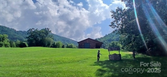 80 Meadow Creek Drive 40 & 61, Weaverville, NC 28787 - view of community featuring a detached garage, a yard, a mountain view, a barn, and an outbuilding