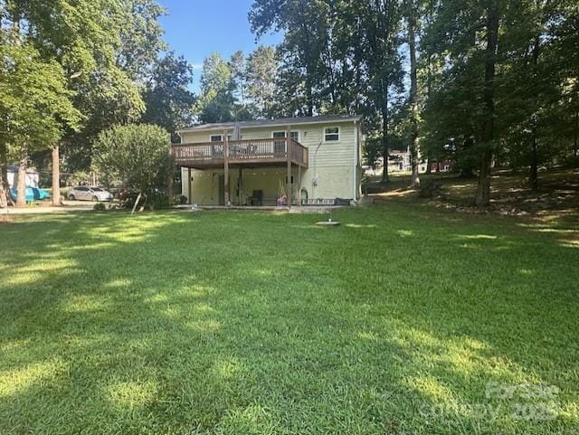3211 Winding Trl, Matthews, NC 28105 - back of property with a wooden deck and a yard