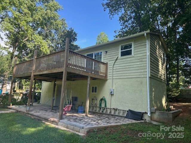 3211 Winding Trl, Matthews, NC 28105 - rear view of property featuring a wooden deck and a patio