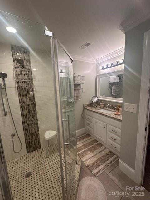 3211 Winding Trl, Matthews, NC 28105 - bathroom featuring vanity, a shower stall, crown molding, and tile patterned flooring