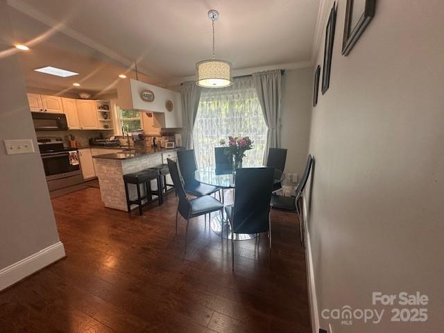 3211 Winding Trl, Matthews, NC 28105 - dining area with dark wood finished floors