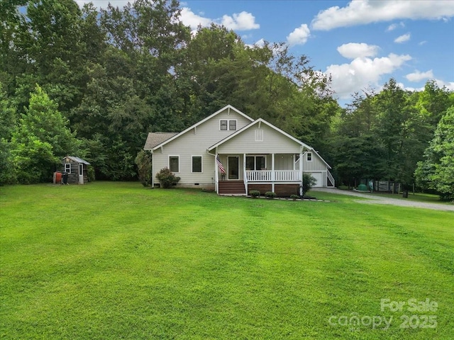 275 Haynes Dr, Salisbury, NC 28146 - view of front of house with a porch, crawl space, a front lawn, a garage, and an outdoor structure