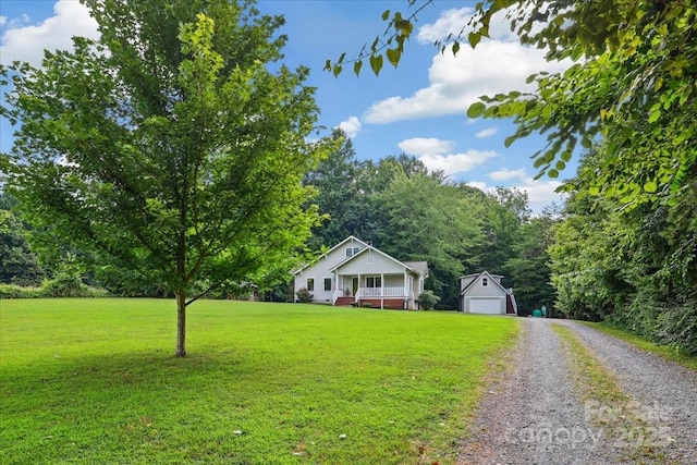 275 Haynes Dr, Salisbury, NC 28146 - view of front of house featuring an outbuilding, a front lawn, a porch, and gravel driveway