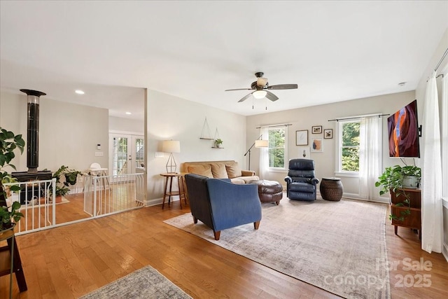 275 Haynes Dr, Salisbury, NC 28146 - living area featuring ceiling fan, wood finished floors, recessed lighting, and a wood stove