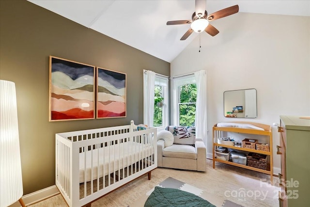 275 Haynes Dr, Salisbury, NC 28146 - bedroom with vaulted ceiling, a crib, wood finished floors, and a ceiling fan