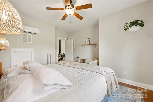 275 Haynes Dr, Salisbury, NC 28146 - bedroom featuring a wall mounted air conditioner, wood finished floors, and a ceiling fan