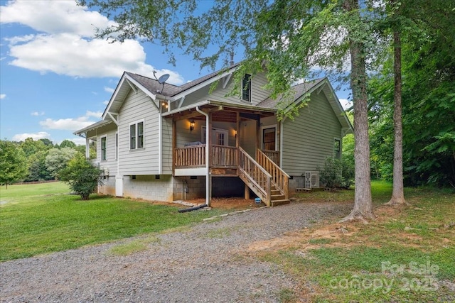 275 Haynes Dr, Salisbury, NC 28146 - view of front facade with covered porch, a front lawn, stairway, and roof with shingles