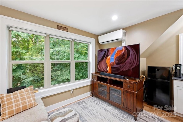 275 Haynes Dr, Salisbury, NC 28146 - living area featuring a wall mounted AC, light wood-style floors, and recessed lighting