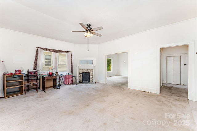 135 Corban Ave SE, Concord, NC 28025 - living area featuring ceiling fan, carpet flooring, and a tile fireplace