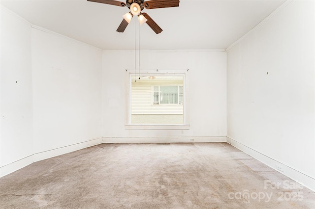 135 Corban Ave SE, Concord, NC 28025 - spare room featuring ornamental molding, a ceiling fan, and carpet floors