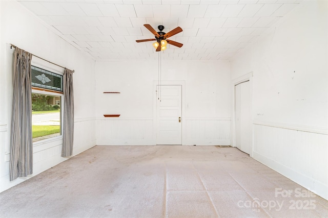 135 Corban Ave SE, Concord, NC 28025 - carpeted spare room featuring ceiling fan and wainscoting