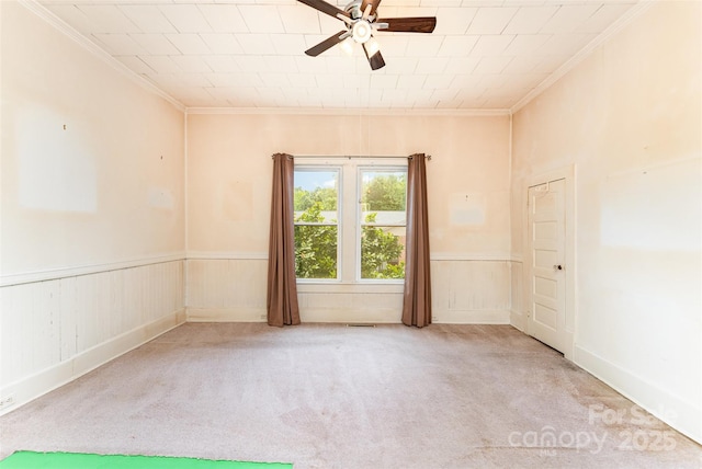 135 Corban Ave SE, Concord, NC 28025 - carpeted spare room with ornamental molding, a ceiling fan, and wainscoting