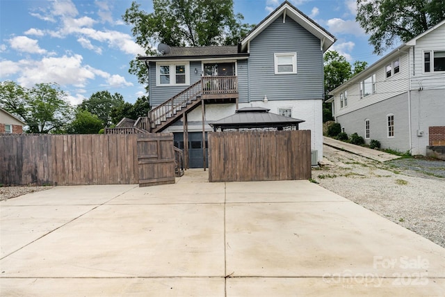 135 Corban Ave SE, Concord, NC 28025 - view of front of home featuring a gazebo, stairway, and brick siding