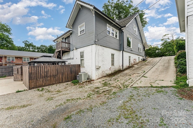 135 Corban Ave SE, Concord, NC 28025 - view of side of home with a gazebo and brick siding