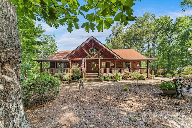279 Outback Trl, Nebo, NC 28761 - rustic home with a porch and a shingled roof