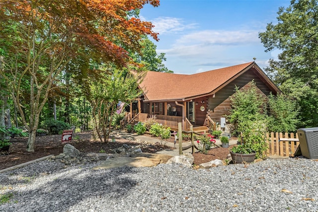 279 Outback Trl, Nebo, NC 28761 - view of front facade featuring a shingled roof and a wooden deck