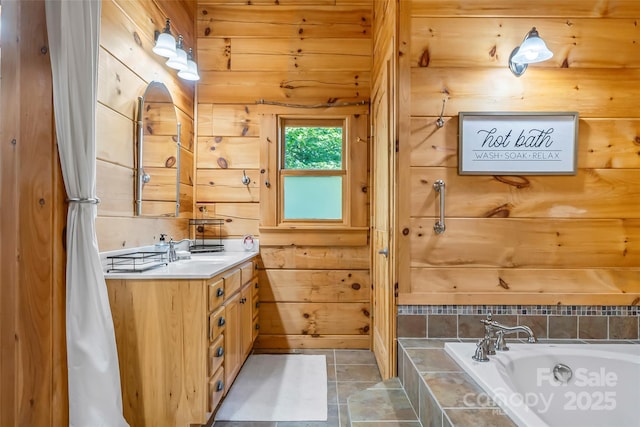 279 Outback Trl, Nebo, NC 28761 - full bath featuring vanity, tiled tub, and wood walls
